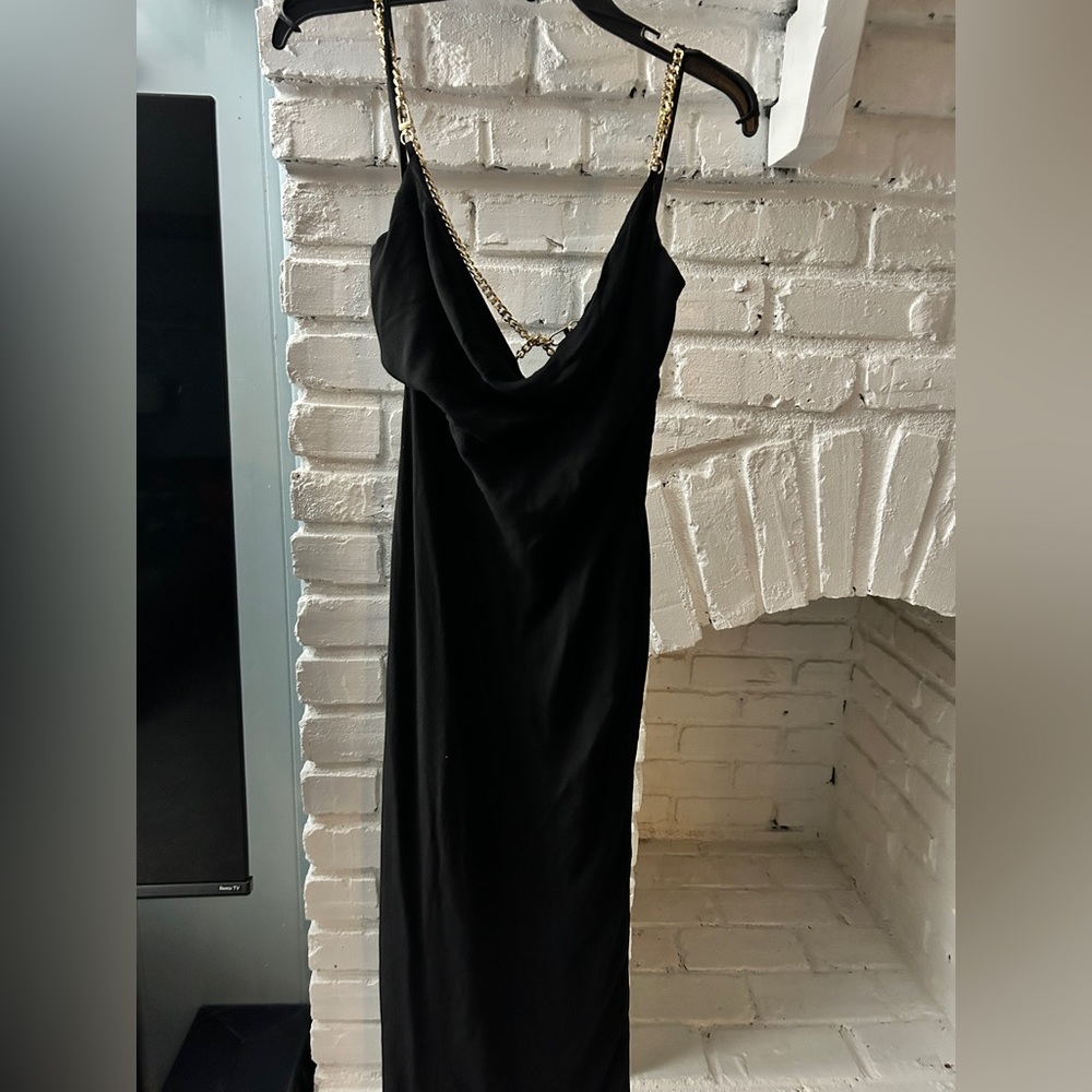 RNWY Black dress with gold chain back detail.